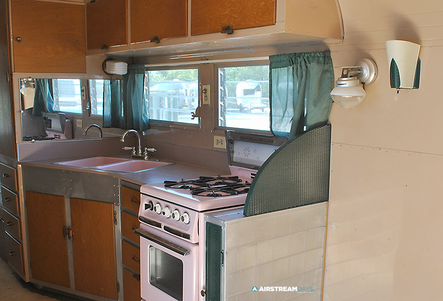 Vintage 1950's Pink Porcelain sink and stove in 1959 Streamliner camper