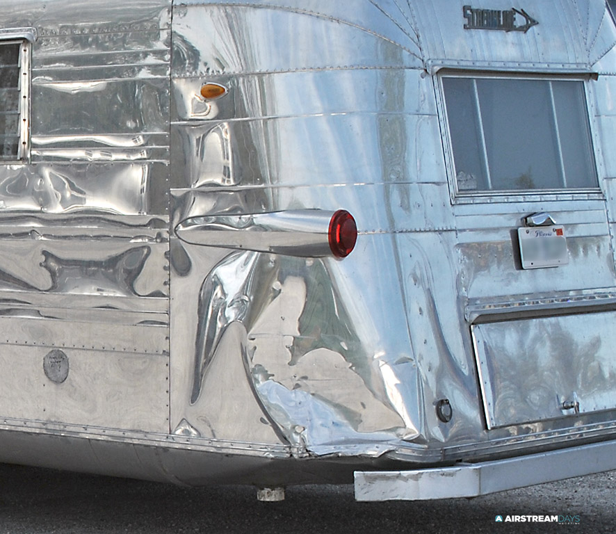 1959 Streamline trailer dented corner panel before replacement.