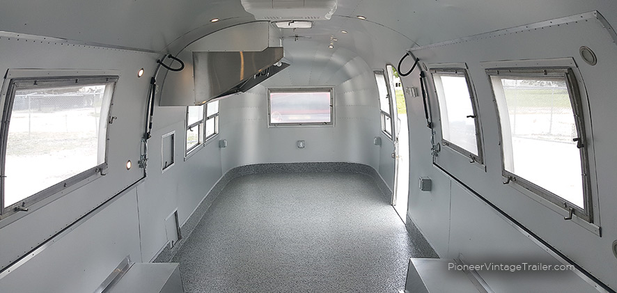 Interior view of serving hatches on both sides of Airstream food trailer