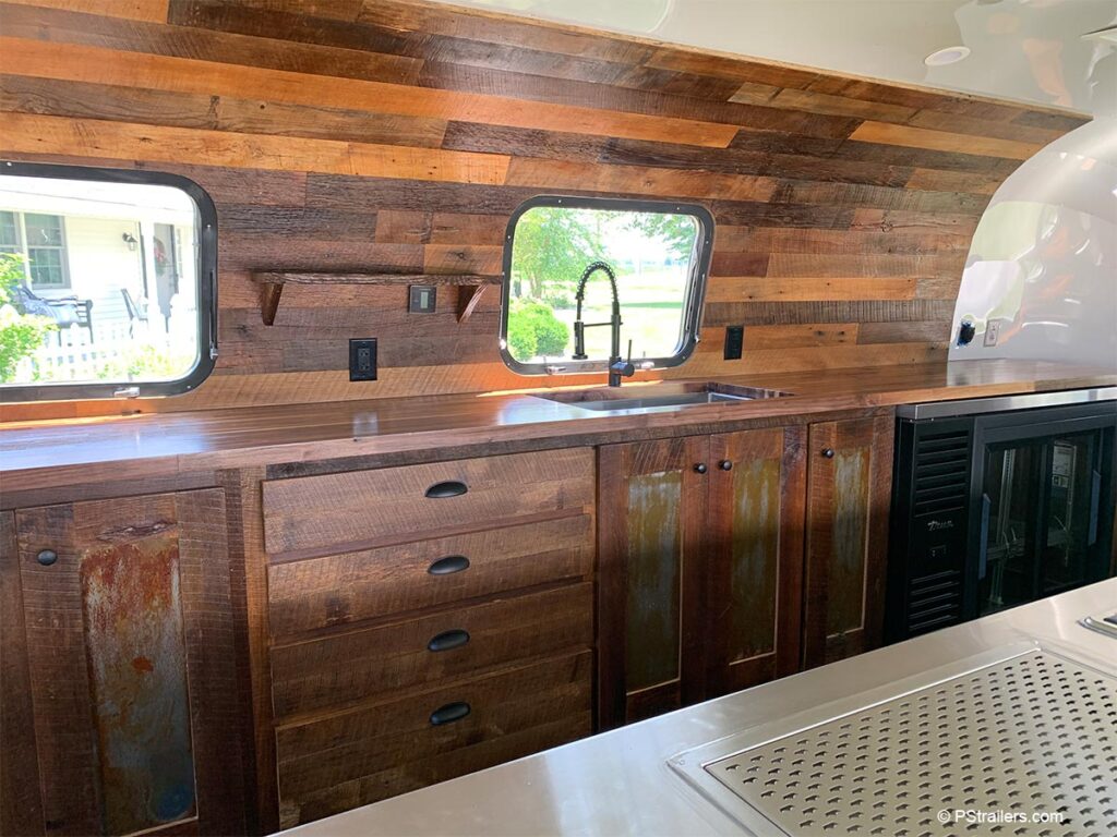 Camp Aramoni Airstream bar with reclaimed wood interior