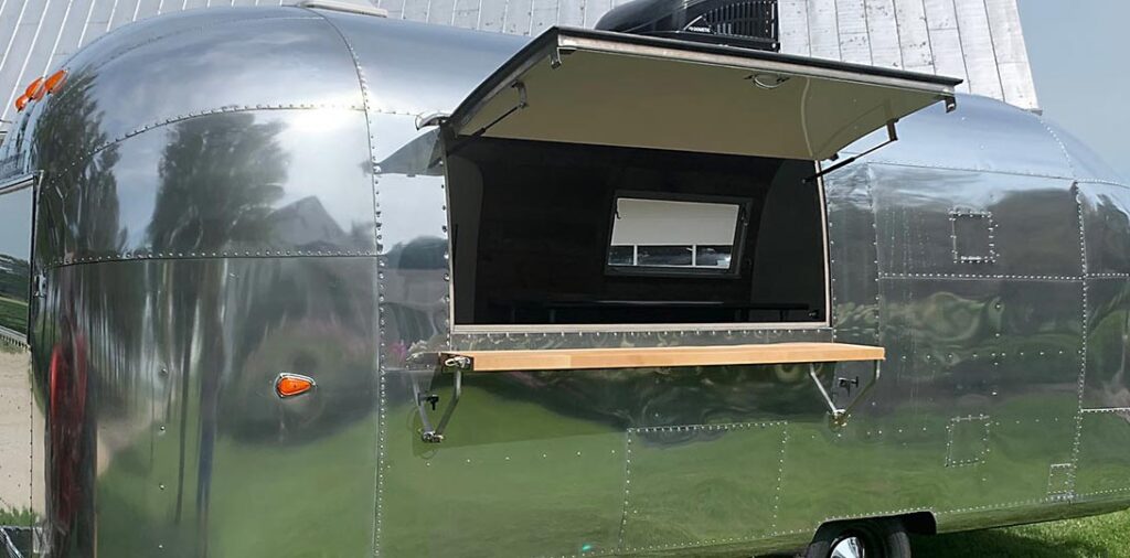 Drop serving shelf on Airstream Bar