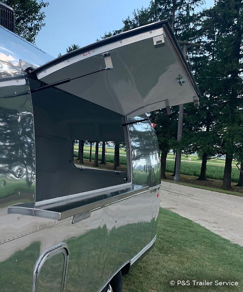 Stainless serving shelf on Airstream bar trailer